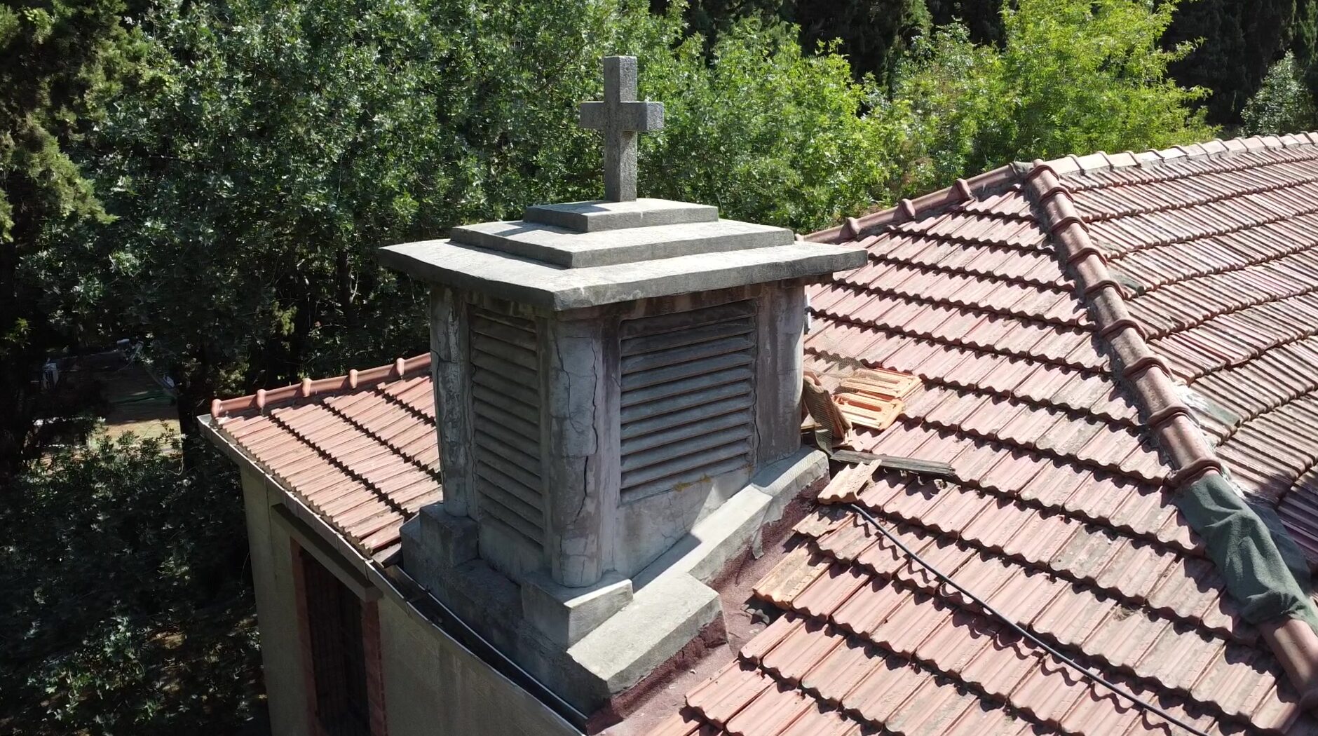Aerial view of the chapel roof and stone cross